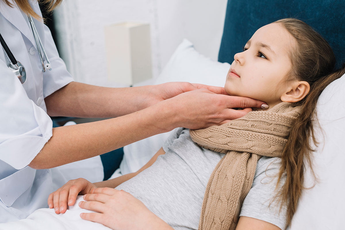 close-up-female-s-doctor-hand-checking-girl-patient-s-throat-neck.jpg